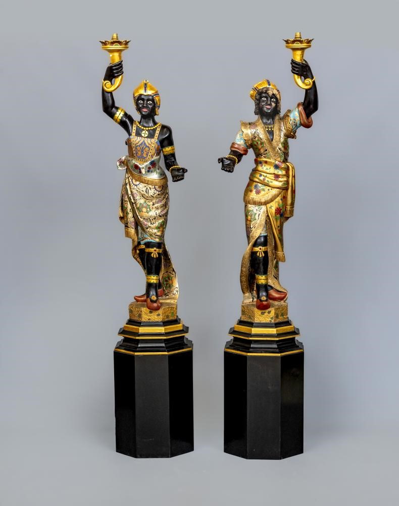 A PAIR OF HAND CARVED POLYCHROME AND GILDED TORCHERE BLACKAMOORS Image