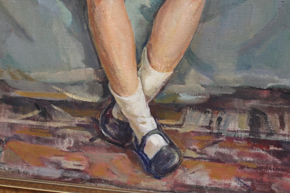 DOROTHY JOHNSTONE (1892-1980) Portrait of a Young Girl seated on an armchair holding a doll Image