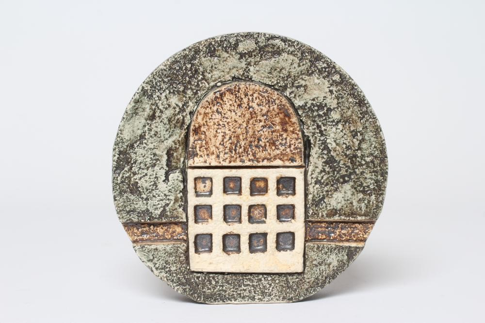 A TROIKA POTTERY SMALL WHEEL VASE with typical incised panels of a portcullis and fish in shades of Image