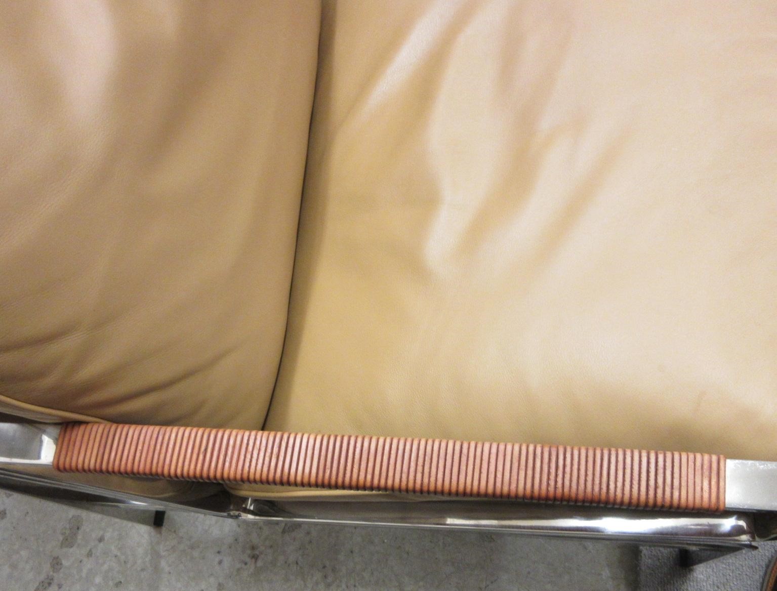 A PAIR OF LEATHER AND CHROME FRAMED ARMCHAIRS Image