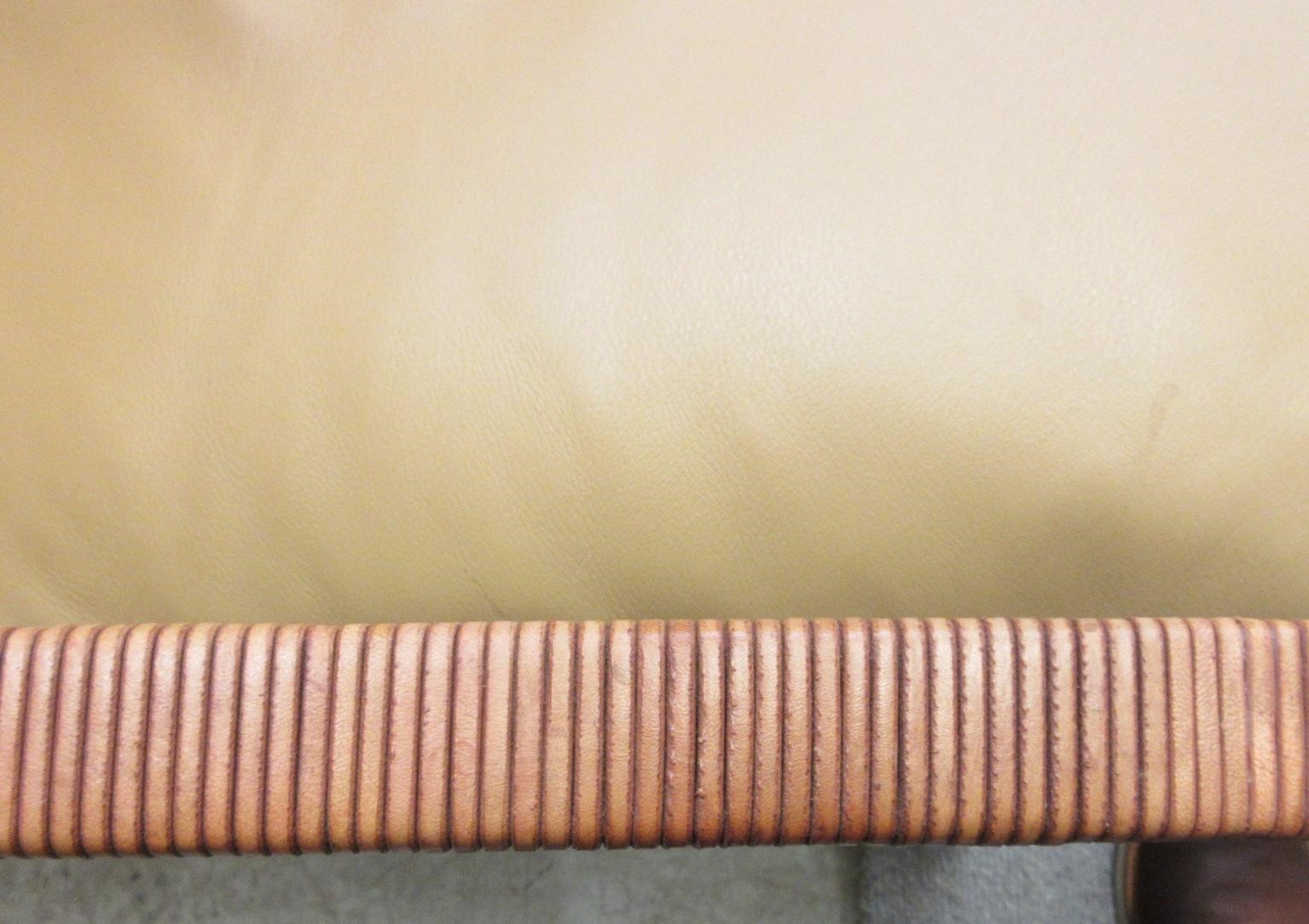 A PAIR OF LEATHER AND CHROME FRAMED ARMCHAIRS Image