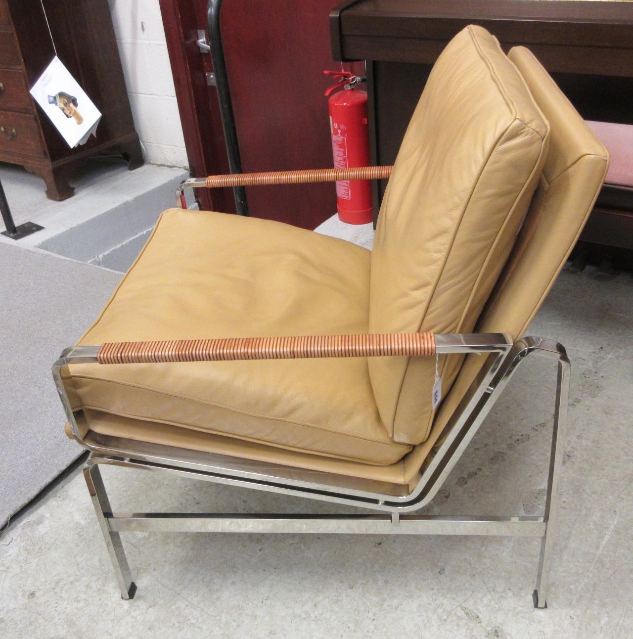A PAIR OF LEATHER AND CHROME FRAMED ARMCHAIRS Image