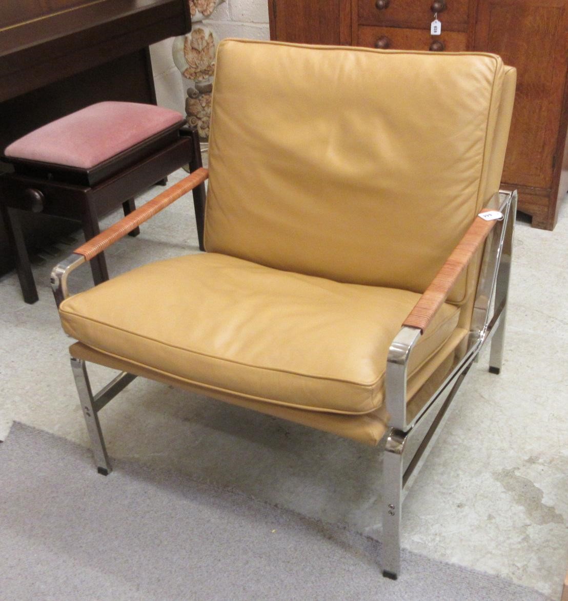 A PAIR OF LEATHER AND CHROME FRAMED ARMCHAIRS Image