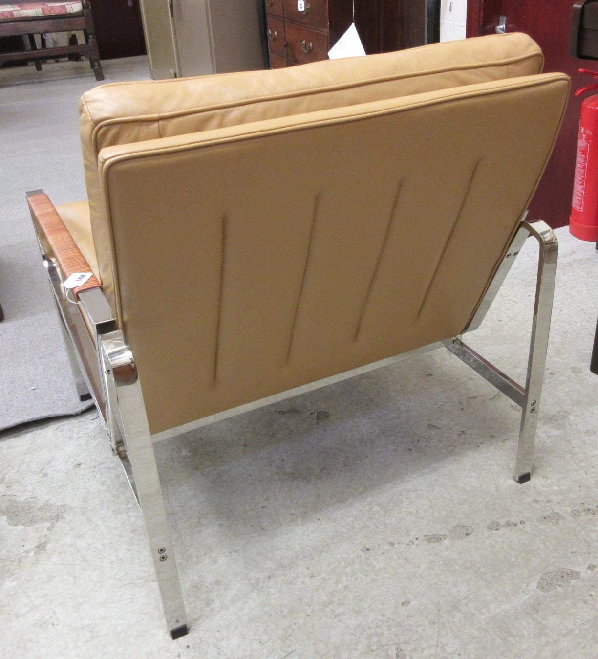 A PAIR OF LEATHER AND CHROME FRAMED ARMCHAIRS Image