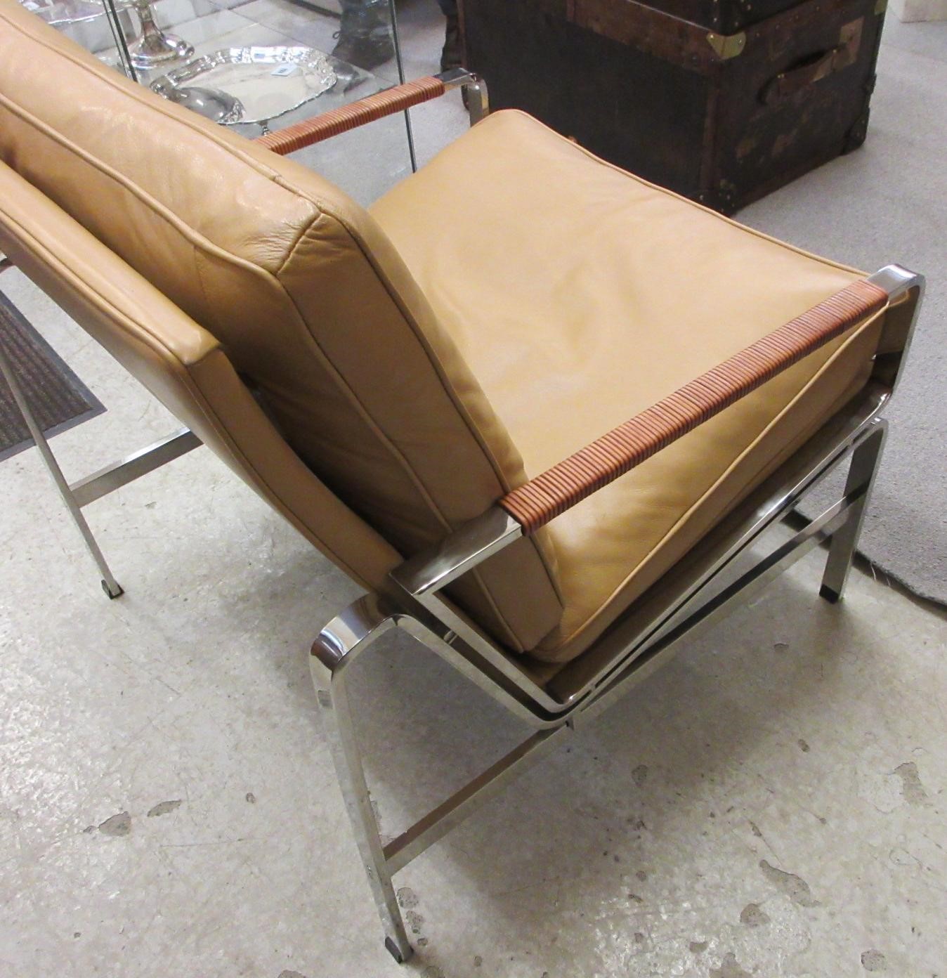 A PAIR OF LEATHER AND CHROME FRAMED ARMCHAIRS Image