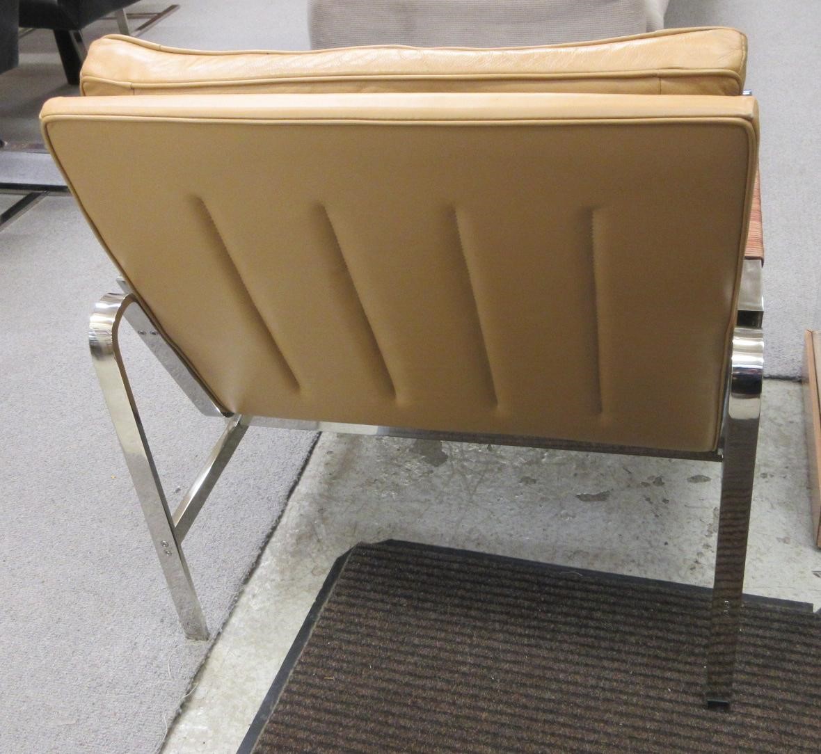 A PAIR OF LEATHER AND CHROME FRAMED ARMCHAIRS Image