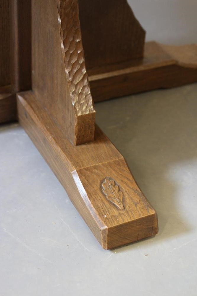 A DAVID LANGSTAFF ADZED OAK DINING TABLE, the circular top with adzed edge, raised on waisted Image