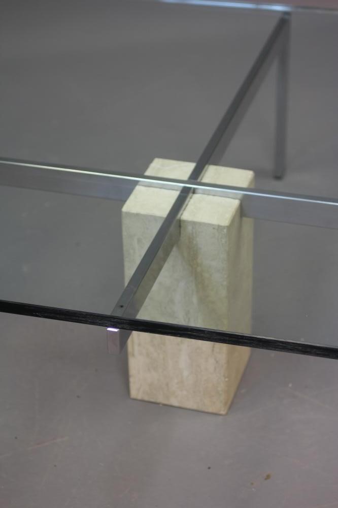 A GLASS AND POLISHED STEEL COFFEE TABLE Image