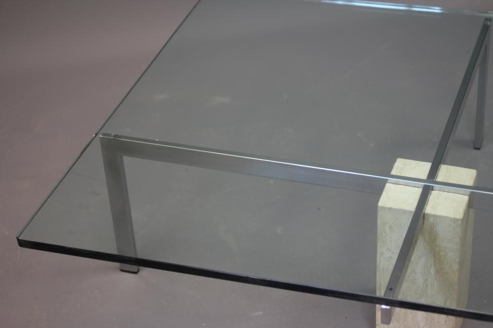 A GLASS AND POLISHED STEEL COFFEE TABLE Image