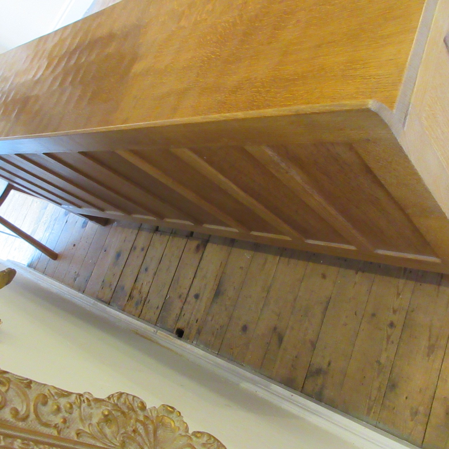 A ROBERT THOMPSON ADZED OAK SIDEBOARD of canted oblong form with ledge back Image