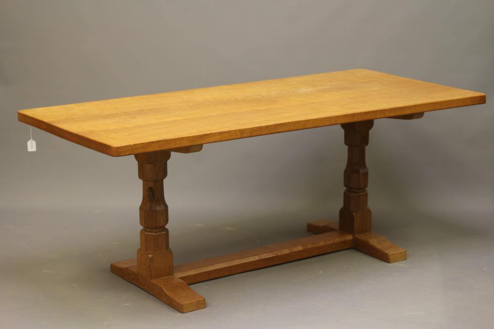 A ROBERT THOMPSON ADZED OAK DINING TABLE Image