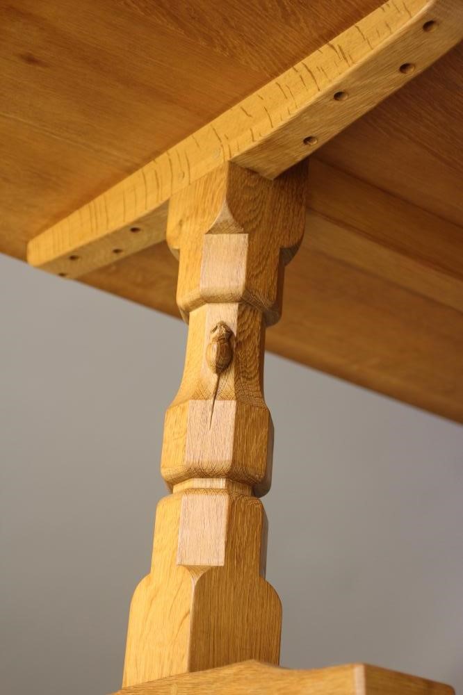 A ROBERT THOMPSON ADZED OAK DINING TABLE Image