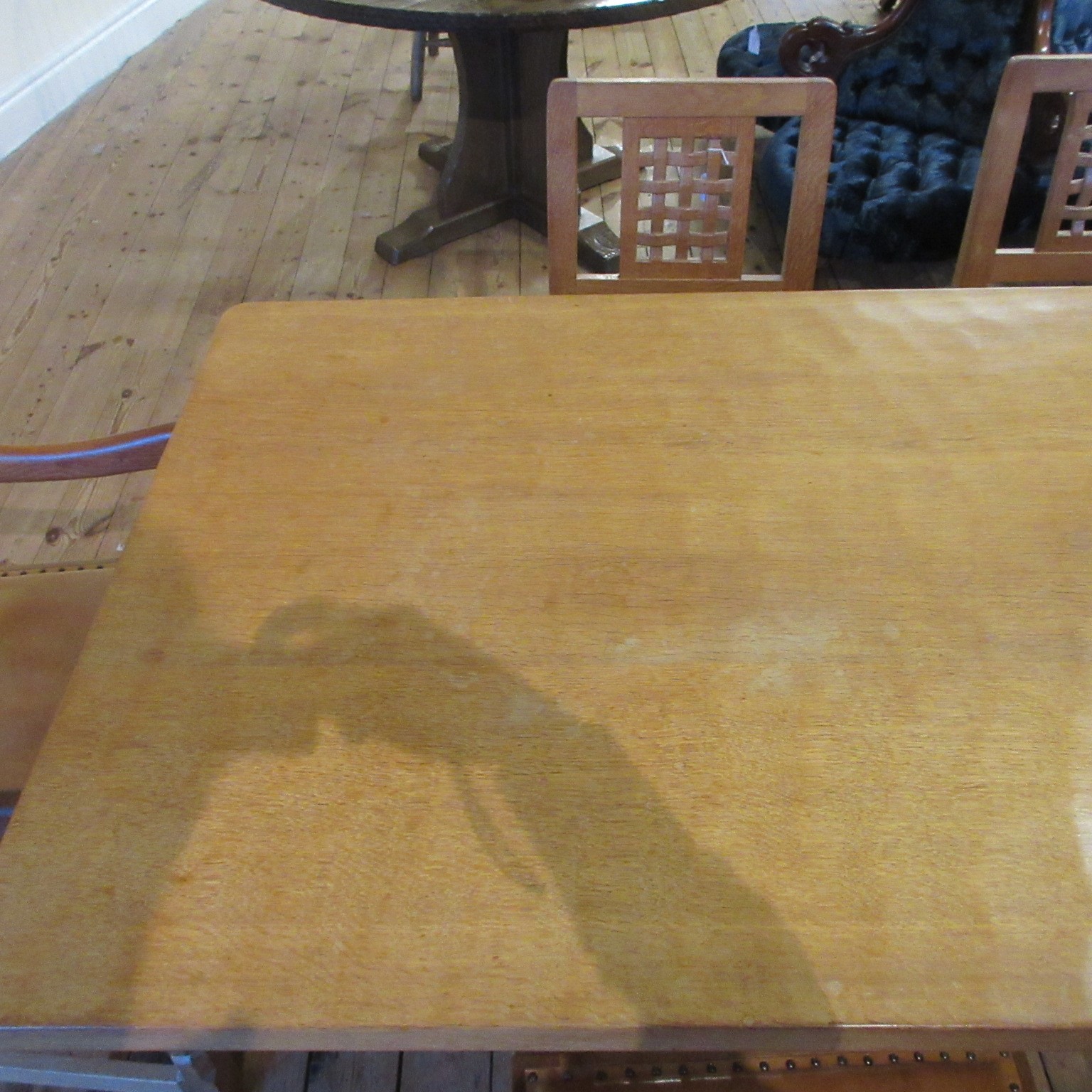 A ROBERT THOMPSON ADZED OAK DINING TABLE Image