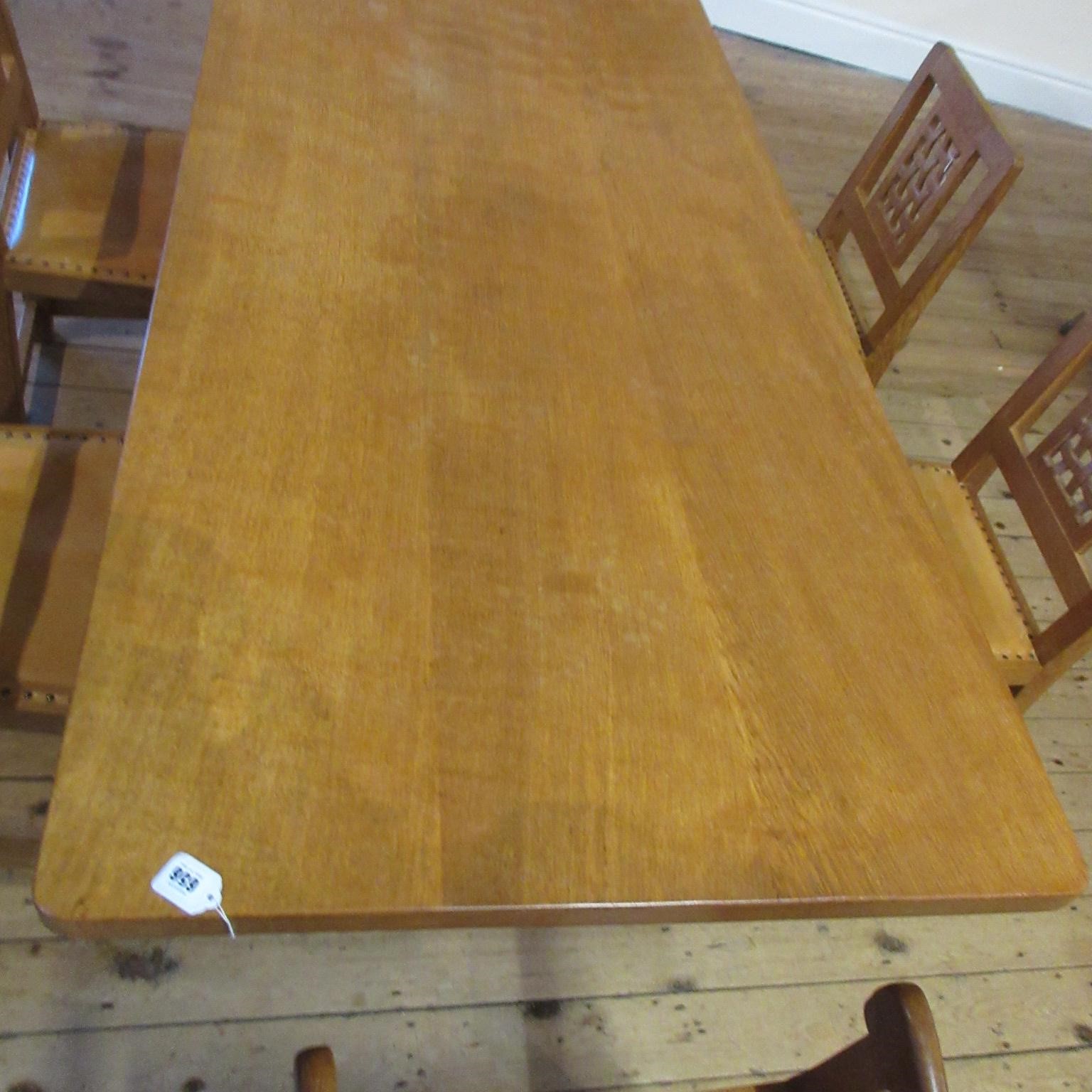 A ROBERT THOMPSON ADZED OAK DINING TABLE Image