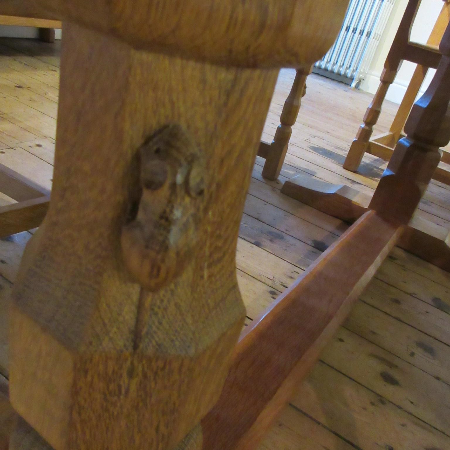 A ROBERT THOMPSON ADZED OAK DINING TABLE Image