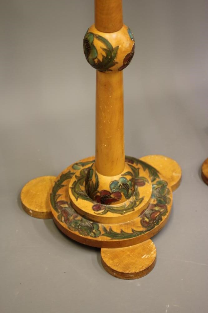 A SET OF FOUR ART DECO LIGHT BEECH STANDARD LAMPS BY CYRIL M ROYLE painted with flowers and foliage Image