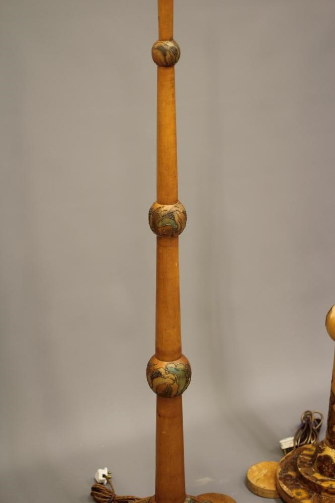 A SET OF FOUR ART DECO LIGHT BEECH STANDARD LAMPS BY CYRIL M ROYLE painted with flowers and foliage Image