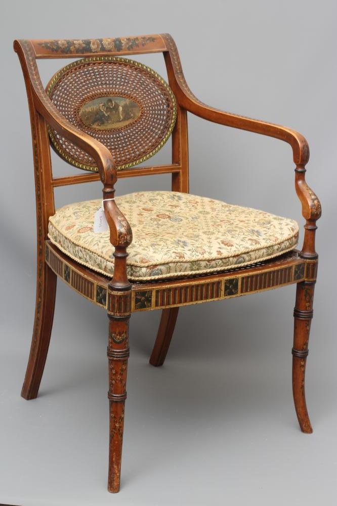 AN EDWARDIAN CANED AND FLORAL PAINTED ELBOW CHAIR Image