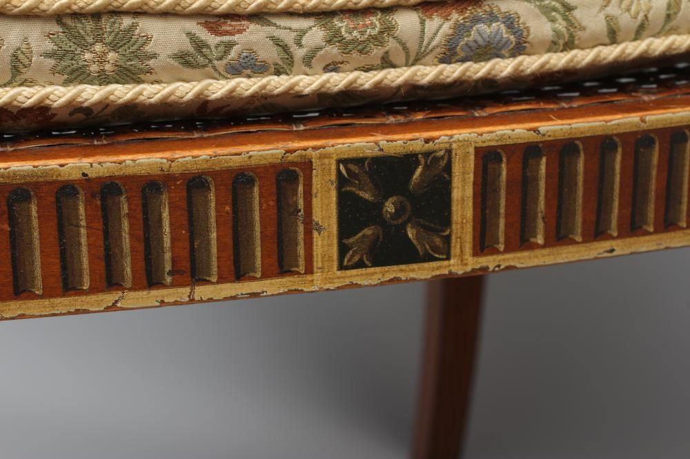 AN EDWARDIAN CANED AND FLORAL PAINTED ELBOW CHAIR Image