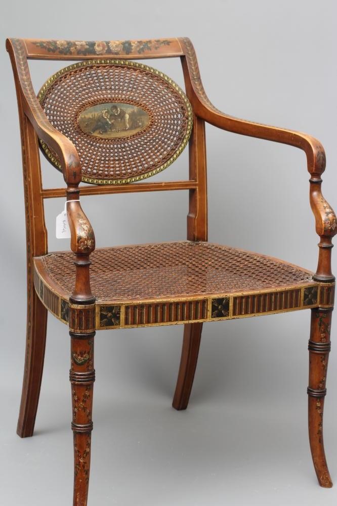 AN EDWARDIAN CANED AND FLORAL PAINTED ELBOW CHAIR Image