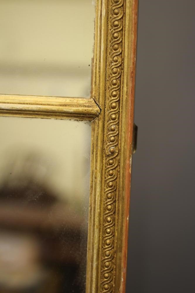 AN EDWARDIAN TRIPLE PLATE GILDED WALL MIRROR, the oblong plates within a chain link moulded gilt Image