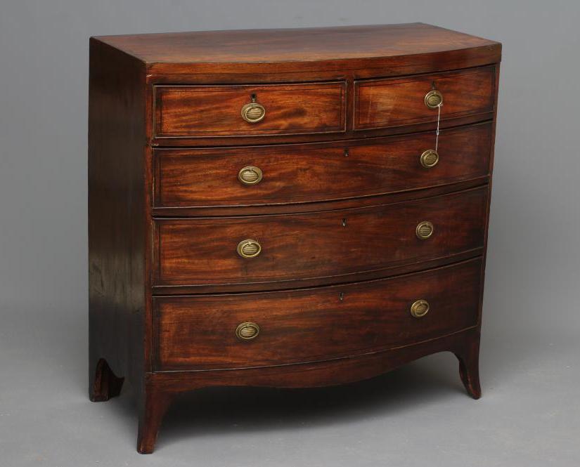 A REGENCY MAHOGANY BOWED CHEST Image