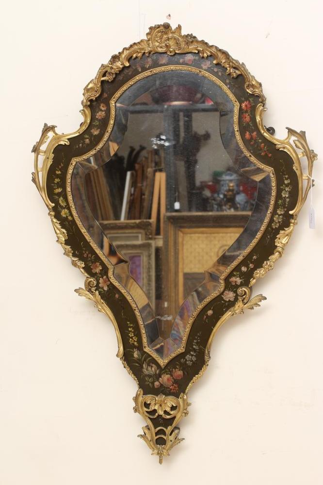 A PAINTED AND GILT METAL MOUNTED WALL MIRROR, 20th century, of shield form in the French rococo Image