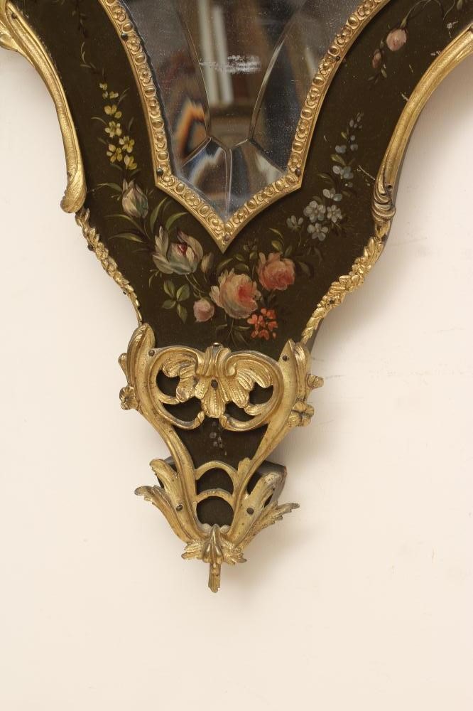 A PAINTED AND GILT METAL MOUNTED WALL MIRROR, 20th century, of shield form in the French rococo Image