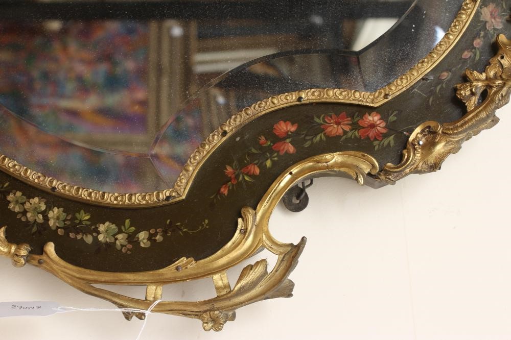 A PAINTED AND GILT METAL MOUNTED WALL MIRROR, 20th century, of shield form in the French rococo Image