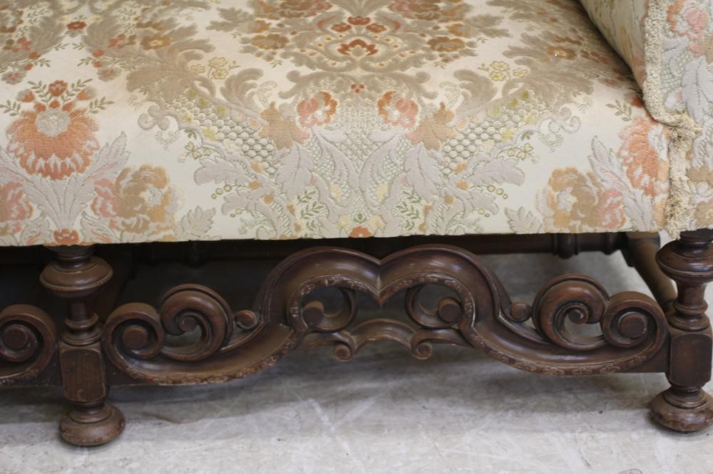 A WILLIAM & MARY STYLE WALNUT FRAMED WING SOFA Image