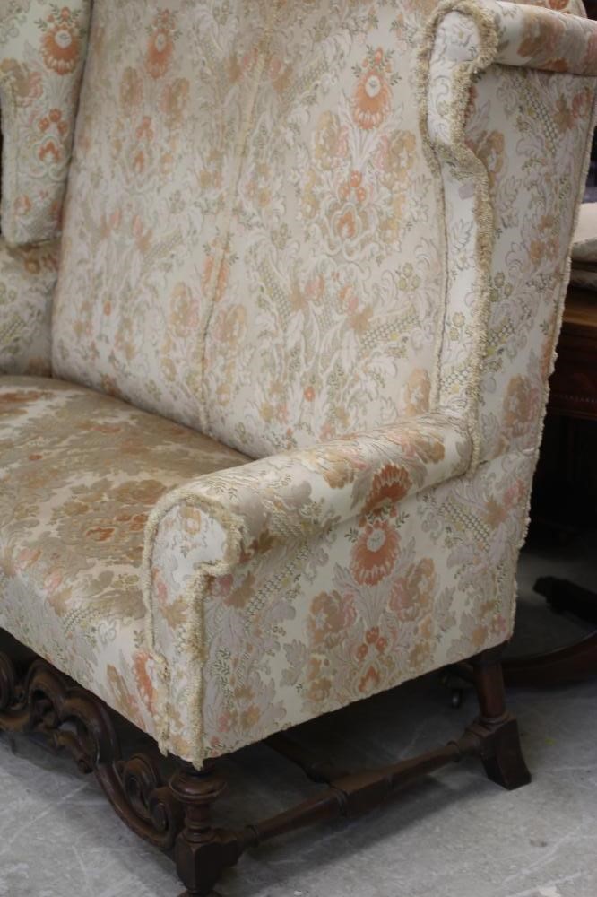 A WILLIAM & MARY STYLE WALNUT FRAMED WING SOFA Image