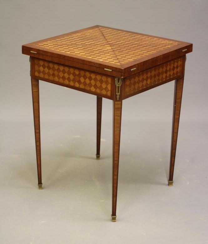 A LOUIS XVI STYLE MAHOGANY AND PARQUETRY ENVELOPE CARD TABLE Image