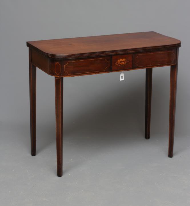 A GEORGIAN MAHOGANY FOLDING TEA TABLE Image