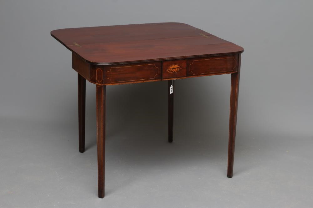 A GEORGIAN MAHOGANY FOLDING TEA TABLE Image