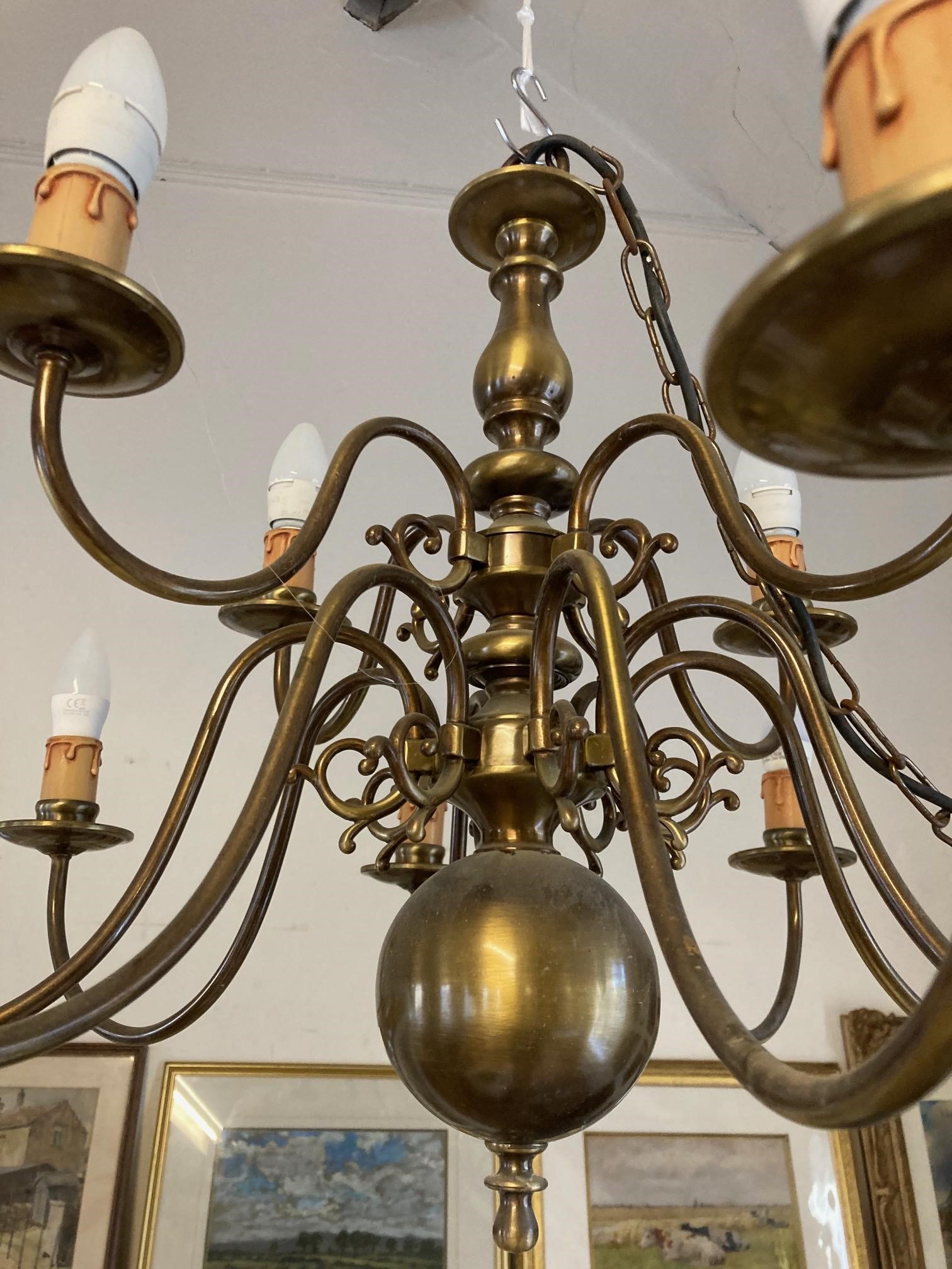 AN IMPRESSIVE BRASS DUTCH STYLE CHANDELIER Image