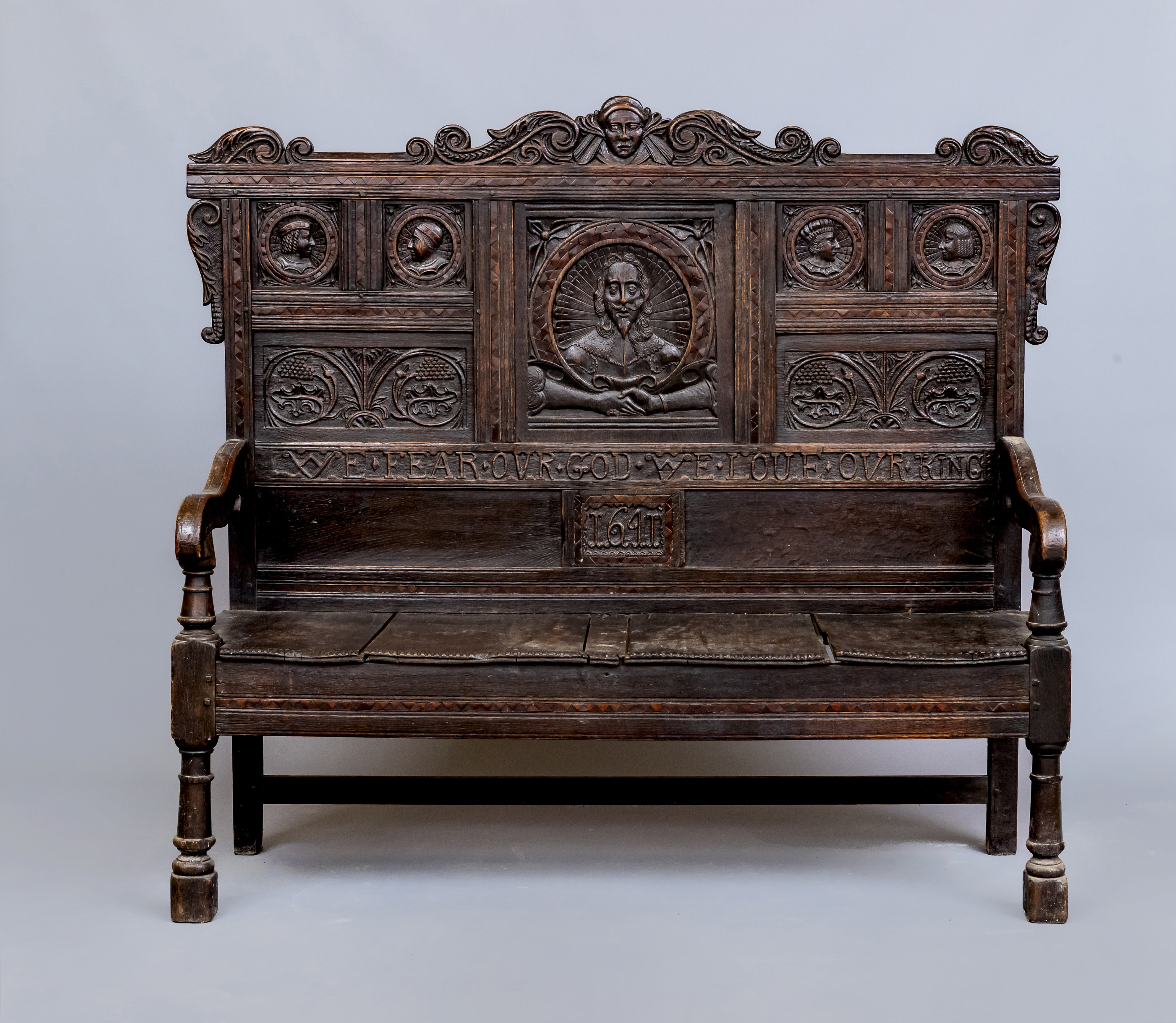 A CARVED OAK SETTLE Image