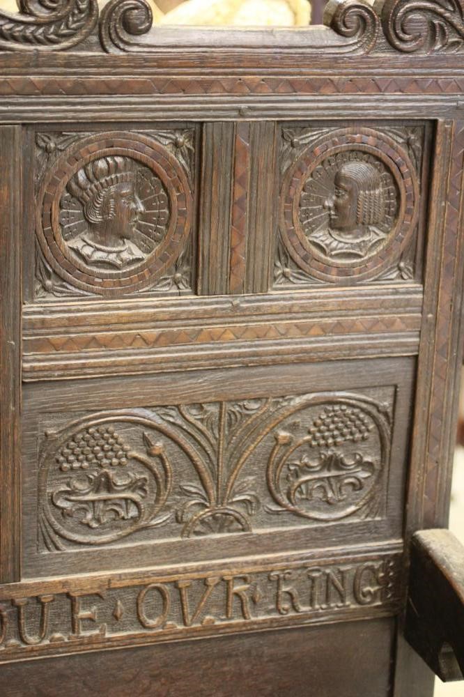 A CARVED OAK SETTLE Image