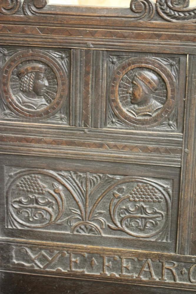 A CARVED OAK SETTLE Image