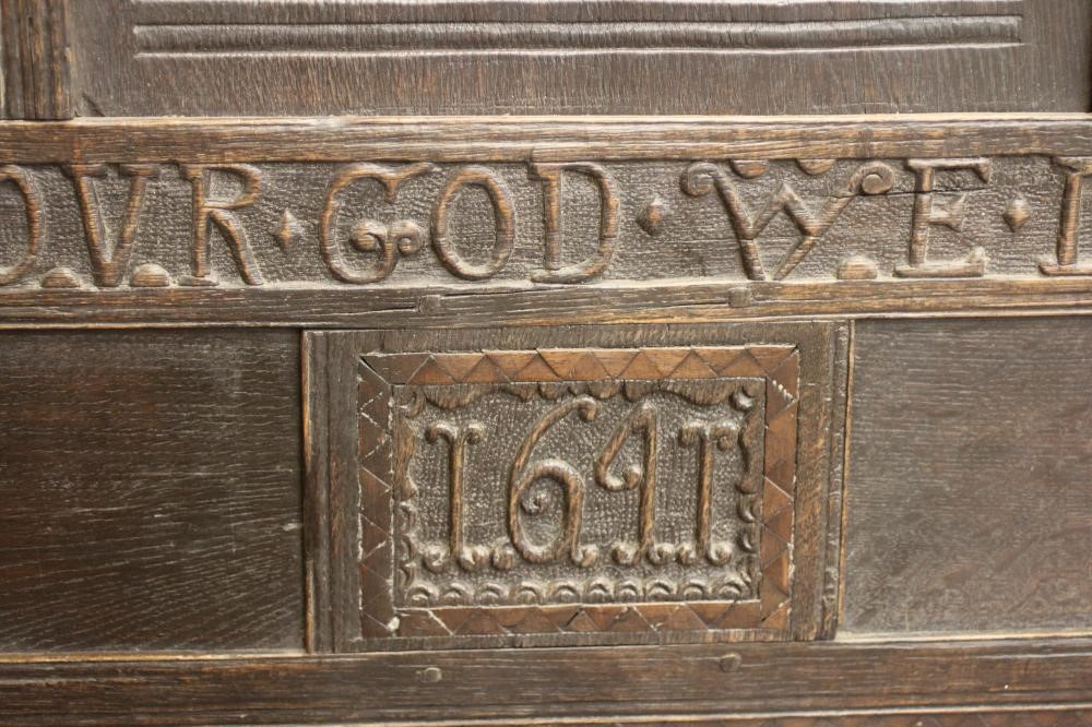 A CARVED OAK SETTLE Image