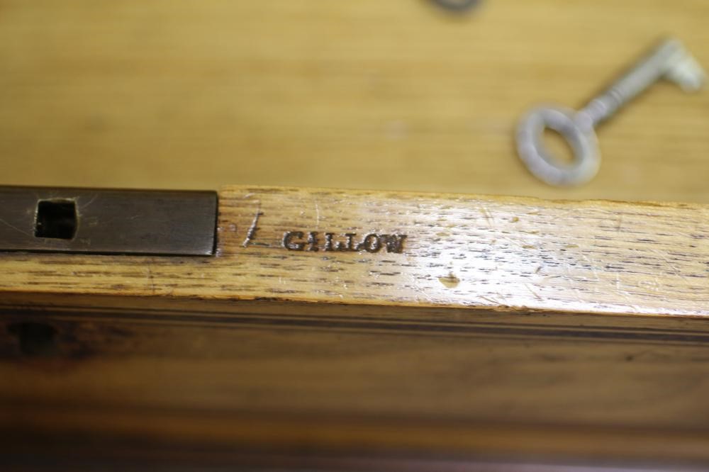 AN ASH AND ROSEWOOD BANDED DAVENPORT BY GILLOW Image