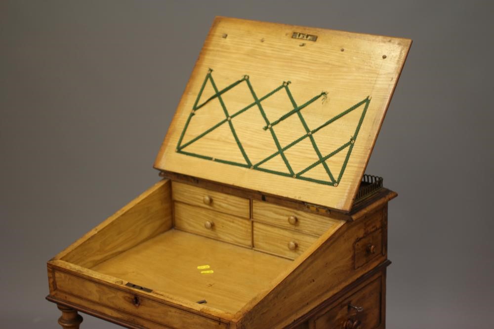 AN ASH AND ROSEWOOD BANDED DAVENPORT BY GILLOW Image