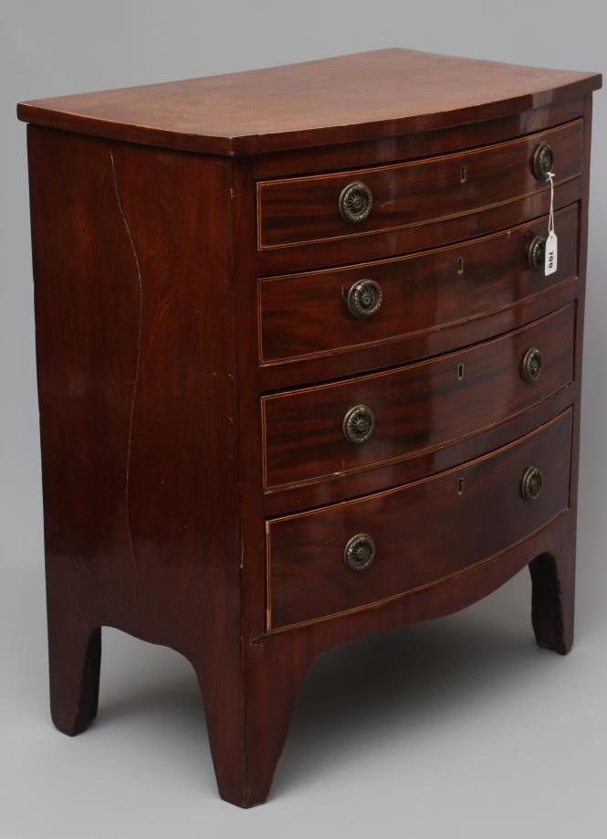 A SMALL BOWED MAHOGANY CHEST Image