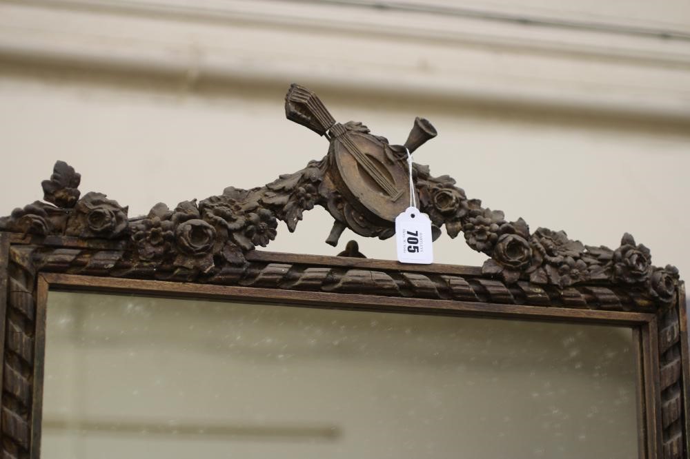 A GILT GESSO PIER GLASS, 19th century, the oblong plate in two divisions within a ribbon border and Image