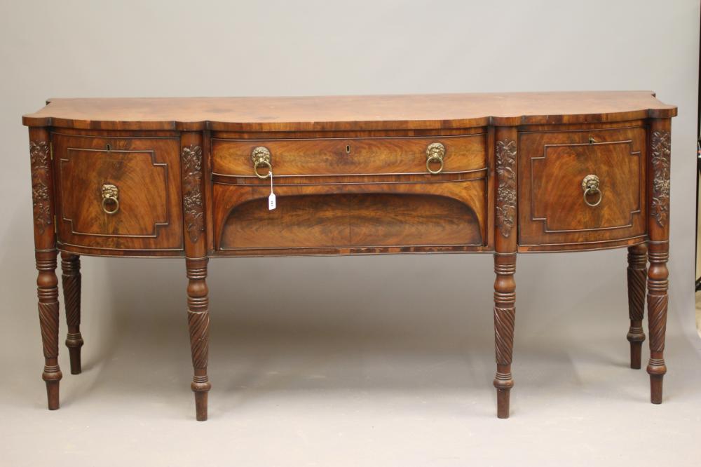 A REGENCY MAHOGANY BOWED SIDEBOARD Image
