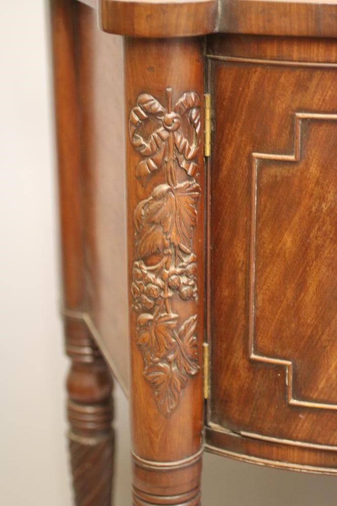 A REGENCY MAHOGANY BOWED SIDEBOARD Image