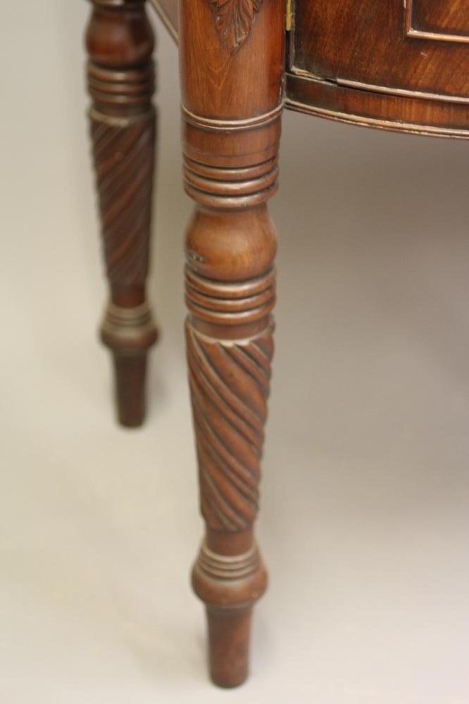 A REGENCY MAHOGANY BOWED SIDEBOARD Image