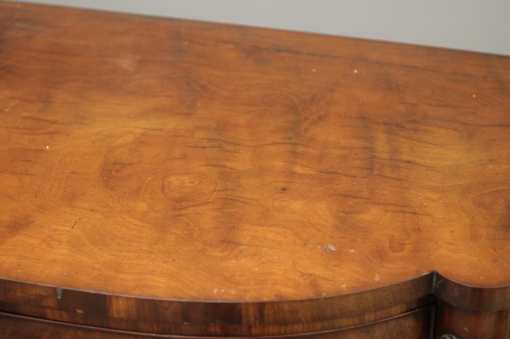 A REGENCY MAHOGANY BOWED SIDEBOARD Image