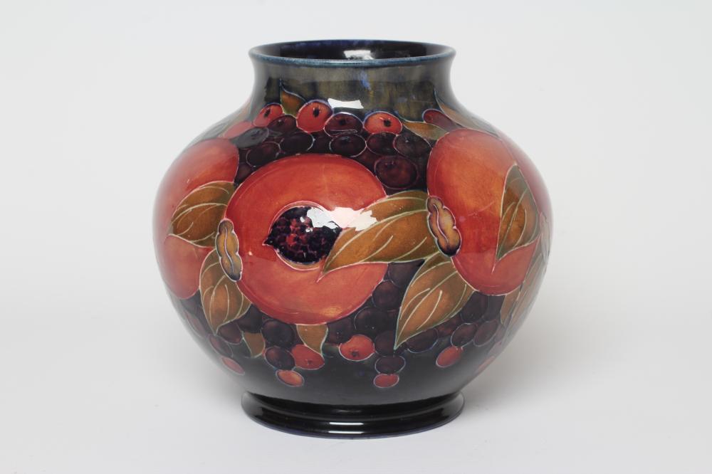 A MOORCROFT POTTERY POMEGRANATE VASE, c.1916, of squat baluster form, signed in green, impressed Image
