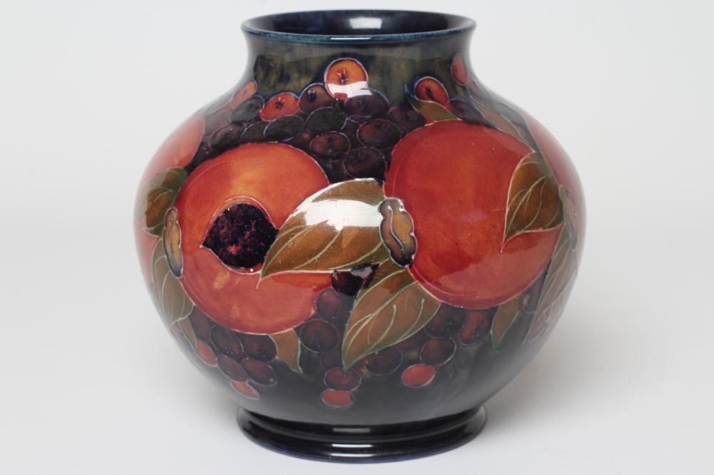 A MOORCROFT POTTERY POMEGRANATE VASE, c.1916, of squat baluster form, signed in green, impressed Image