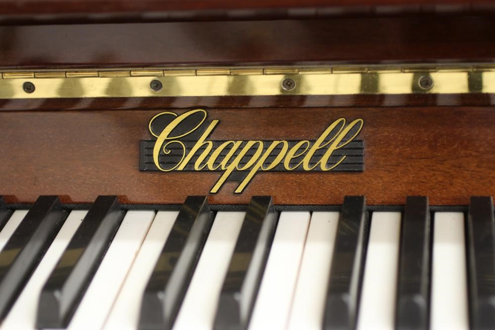 AN UPRIGHT MAHOGANY CASED PIANO BY CHAPPELL Image